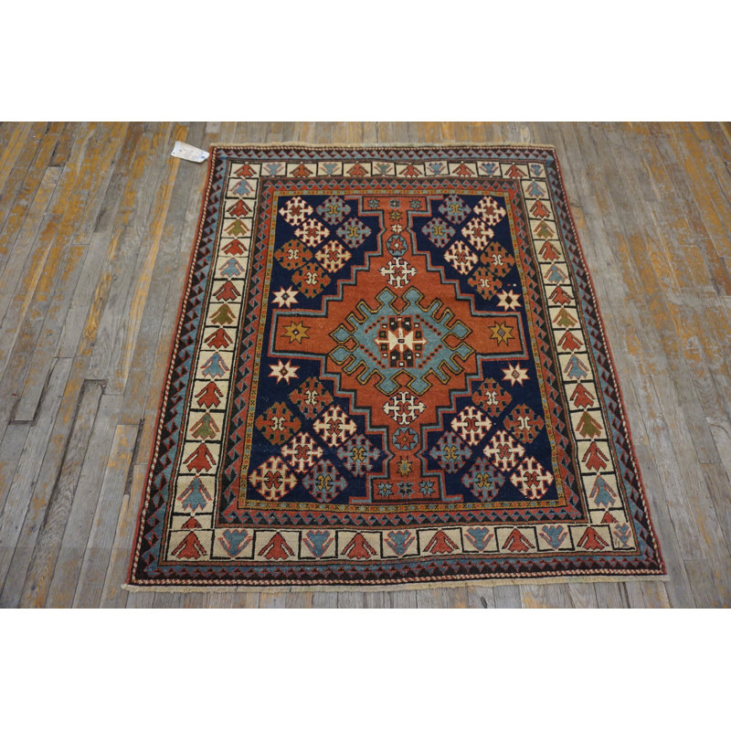 Petit tapis noué à la main de style tribal antique