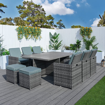 Daoudiate 6 - Person Wicker Patio Dining Set with Rectangular Table , Cushions Included