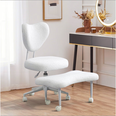 Ce fauteuil de méditation est un fauteuil ergonomique à pieds croisés avec soutien lombaire et un coussin de siège réglable en hauteur, idéal pour les personnes qui font un travail de bureau à haute intensité.