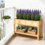 Boîte à fleurs surélevée à deux niveaux avec rangement et drainage efficace, parfaite pour un jardinage facile et organisé.-1351193756
