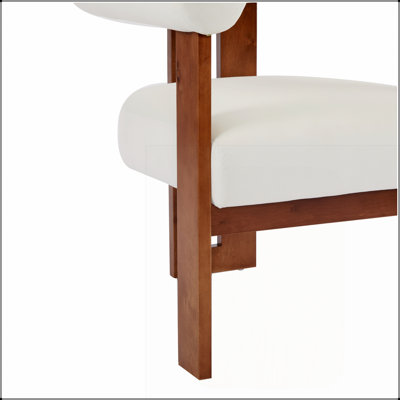 Fauteuil d'appoint moderne avec accoudoirs ronds et revêtement en velours, idéal pour un intérieur contemporain et un confort élégant.