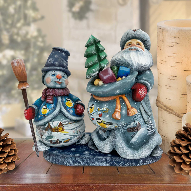Figurine chef-d'œuvre de père Noël sculpté sur bois avec bonhomme de neige