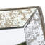 Miroir antique argenté avec détails floraux