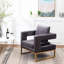 Fauteuil gris contemporain - Style avec assise rembourrée, structure en métal, dossier carré, accoudoirs confortables et revêtement en tissu doux effet velours, pour une détente optimale.