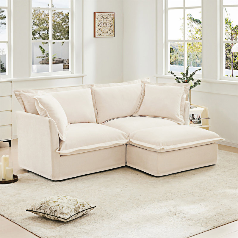 Canapé en tissu avec repose-pieds convertible