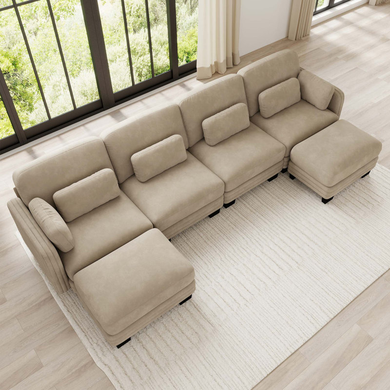 Canapé d'angle modulaire capitonné avec poufs amovibles