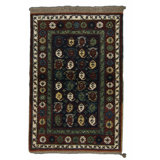 Seychour Wool Oriental Area Rug in Green/Red