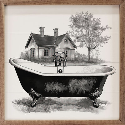 Baignoire de campagne noire avec maison blanche