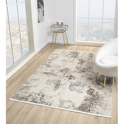 Tapis abstrait beige / bleu de la collection Taige