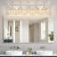 Luminaire de salle de bain moderne à 5 lumières avec accents de cristal et finition nickel brossé pour un éclairage mural élégant