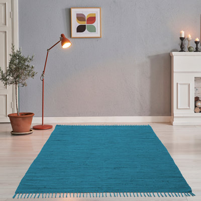 Handmade Happy cotton rug in turquoise