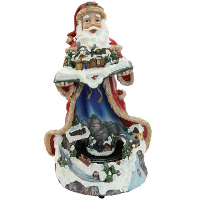 Père Noël illuminé et train en mouvement
