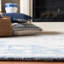 Tapis oriental ivoire / bleu en coton touffeté à la main Cyrrilagnin-836608590
