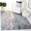 Tapis rose / bleu à motif abstrait Nashota-452665008