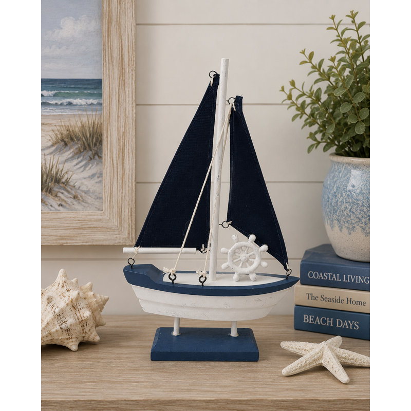 Figurine voilier avec voiles foncées