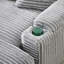 Grey corduroy single sofa with one pillow, two throw pillows, a footstool and two storage Spaces.
