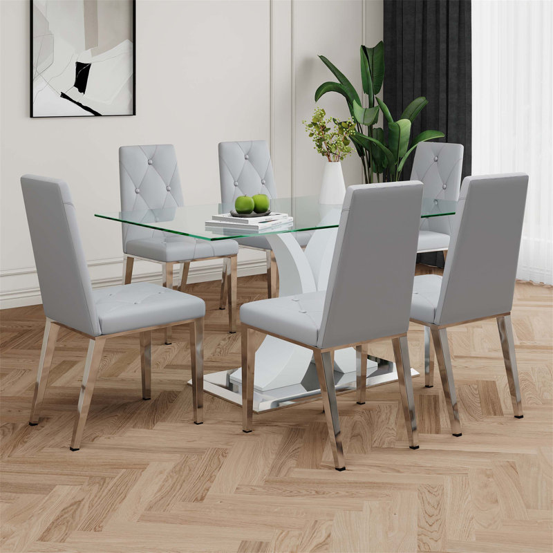 Ensemble de table de salle à manger moderne en verre avec un design élégant et un support durable, chaises de salle à manger gris clair avec pieds galvanisés, idéal pour les cuisines de restaurant