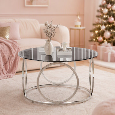 Table basse ronde moderne en verre trempé avec cadre circulaire en métal pour un décor de salon contemporain
