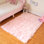 Tapis rose en fausse fourrure à poils longs lavable
