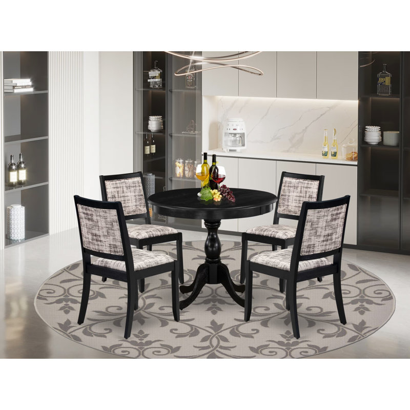 L'ensemble de salle à manger 5 pièces comprend une table de cuisine ronde avec plateau de table noir brossé et 4 chaises empilables en tissu de polyester, noir brossé