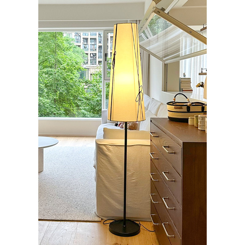 Mid-century style floor lamp with hardware structure, fabric and PVC elements
