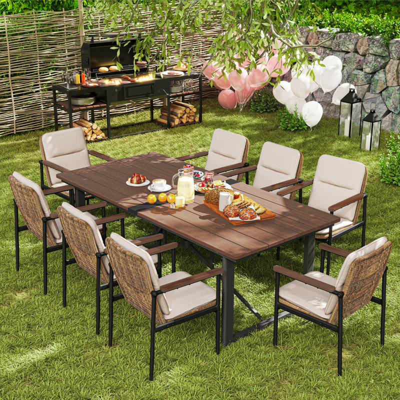 Ocanas 9-Piece Aluminum Outdoor Dining Set With Wooden Table Top, Wicker Chairs And Light Gray Cushions
