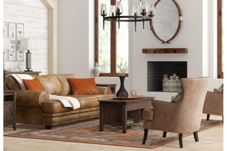 bright, mission-style living room with a plush leather sofa and a solid-wood coffee table