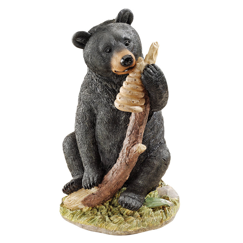 Figurine miel et ours noir curieux