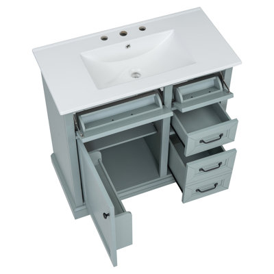 Meuble-lavabo de 91 cm (36 po) avec lavabo en céramique, 2 tiroirs basculants et tiroirs coulissants, charnières de porte à fermeture amortie, tablette réglable avec dos ouvert.
