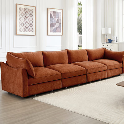 Quatre tiroirs, très grand tiroir de rangement en chenille orange, conception aux lignes épurées, repose-pieds dissimulé, confortable et rangement large pour sièges profonds, matériau en peau douce en forme de croissant