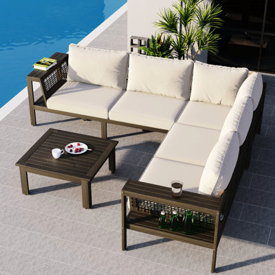 Mobilier d'extérieur en bois pour patio en L 4 pièces en maille tissée, table basse et sièges en mousse, côté conversation confortable et élégant idéal pour les fêtes