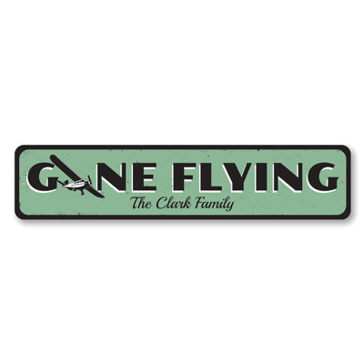 Plaque en métal «Gone Flying»