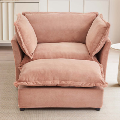 Fauteuil moderne avec repose-pieds mobile, siège large, accoudoirs courbés et coussins moelleux pour un confort douillet