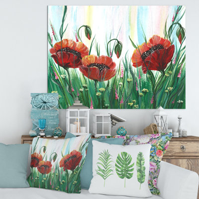 Fleurs de coquelicot rouge vif sur un pré vert - peinture sur toile