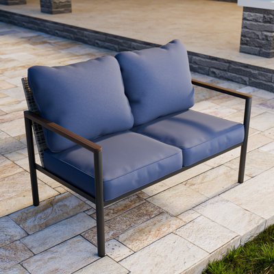 Causeuse avec accoudoirs et coussins en bois