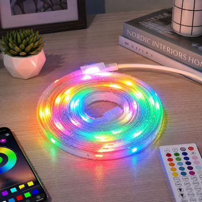 A 6.6FT waterproof RGB strip with battery power and USB operation, color changing, music sync, plus app and remote control for TV, cabinet, closet, shelf, and DIY lighting.