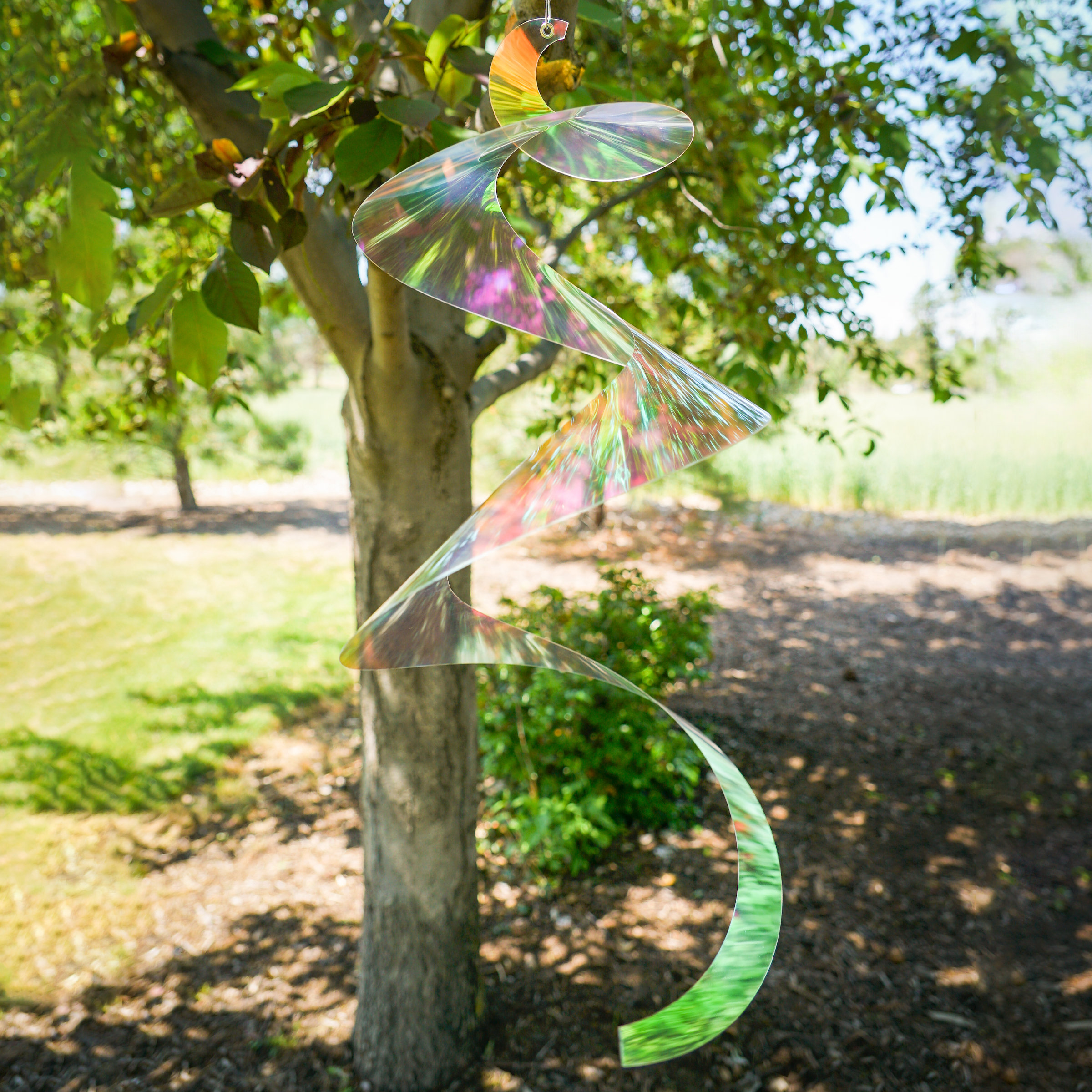 In The Breeze 30-inch Iridescent Twister Tail Spinner | Wayfair