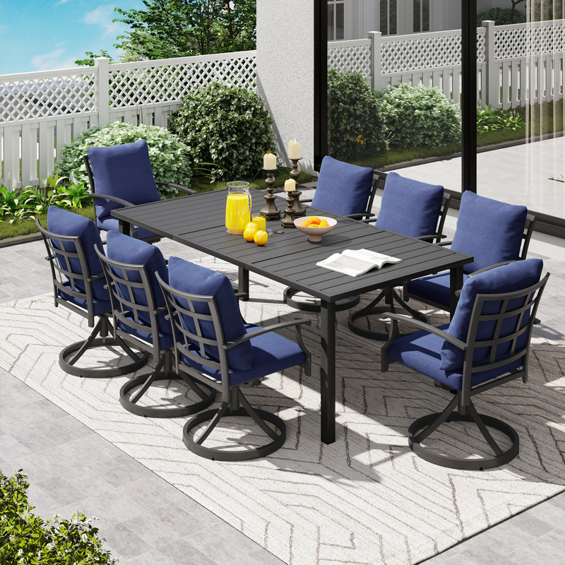 Ensemble de salle à manger de patio en métal noir 9 pièces avec table rectangulaire, 8 chaises pivotantes et coussins bleus Maynard