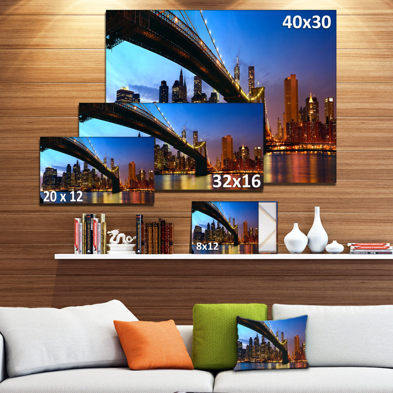 Manhattan Cityscape with Bridge Under Blue Sky Canvas Print