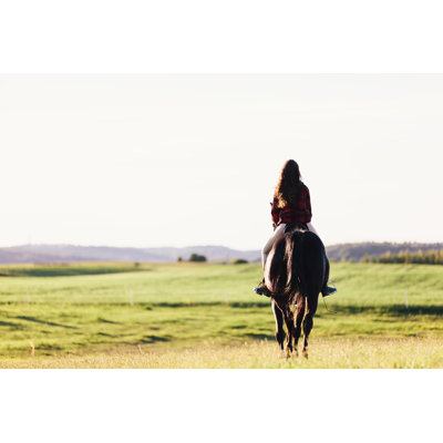 Girl Sitting On A Horse by NiseriN - Wrapped Canvas Print