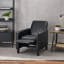 Fauteuil à dossier poussoir en cuir noir pour une décoration intérieure élégante