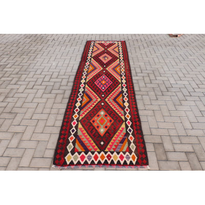 Handwoven Wool Turkish Kilim Runner Carpet In Stunning Red Color With Geometric Pattern And Bohemian Style Ideal For Adding A Touch Of Vintage Anatolian Decor To Your Home