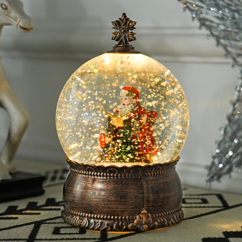 Boule à neige musicale avec paillettes tourbillonnantes