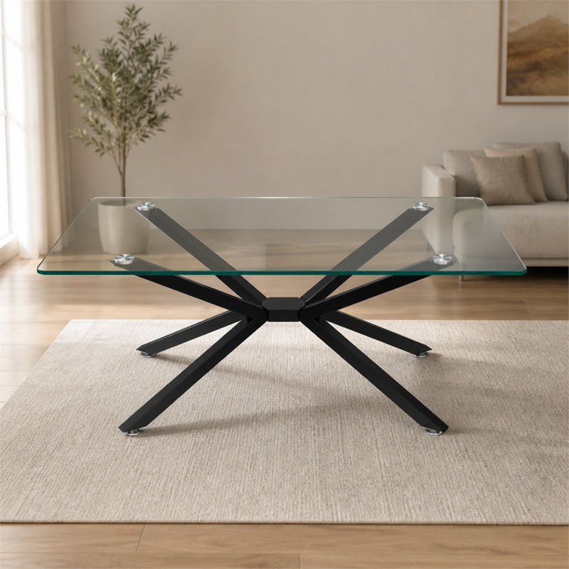 Une table basse rectangulaire en verre trempé de 39,37 pouces au design élégant et aux pieds en métal noir, qui convient au salon.