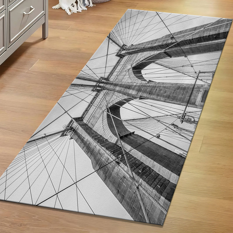 Tapis à motif géométrique moderne non tissé à motif mince avec un subtil agencement de gris et de blanc avec un motif en treillis complexe