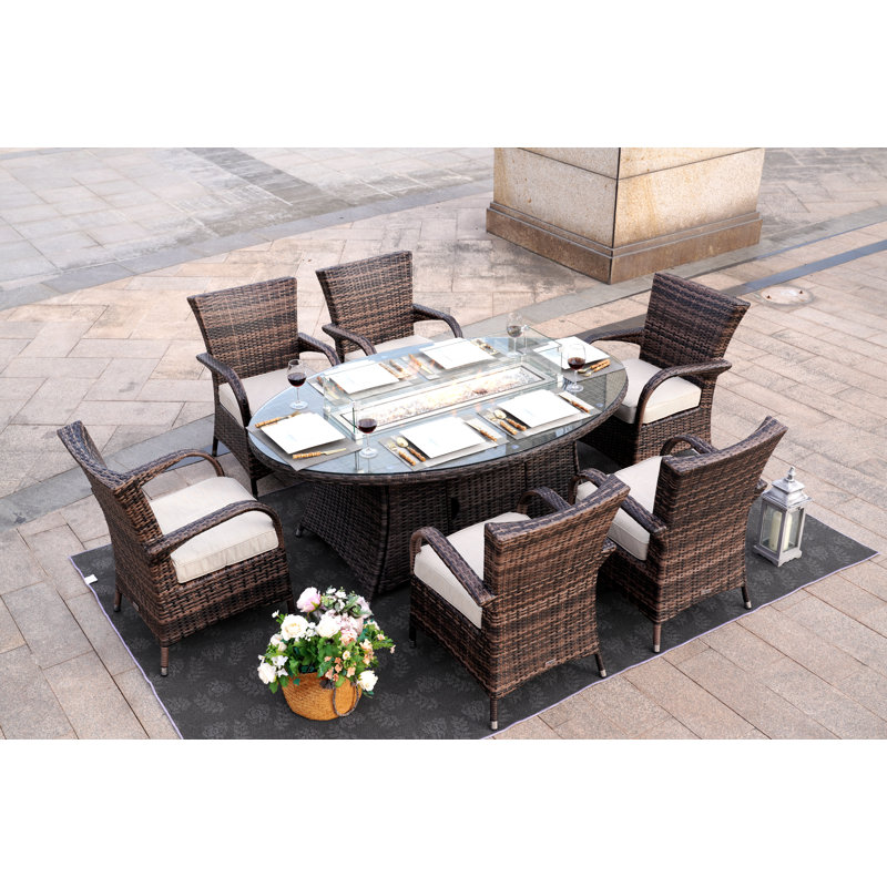 Omied 6 - Person Wicker Patio Dining Set with Oval Table , Cushions Included