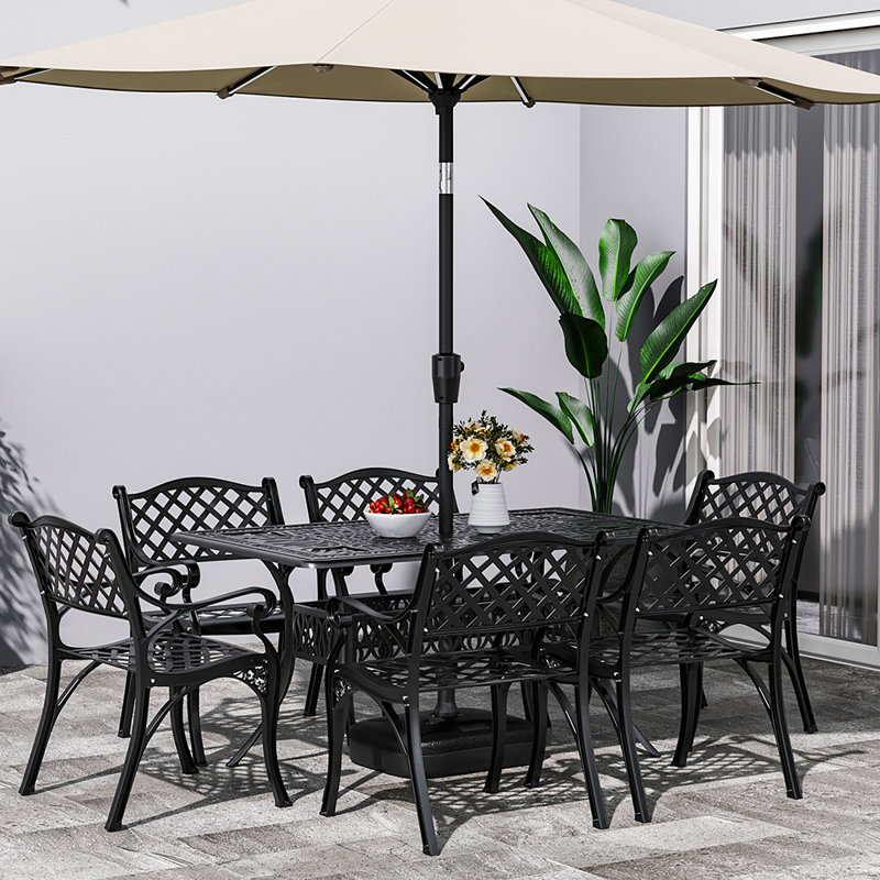 Claudi 6 - Person Patio Dining Set with Rectangular Table , Cushions Included, Black