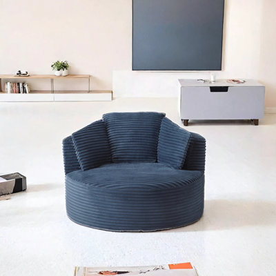 Fauteuil rond en velours côtelé à dossier doux