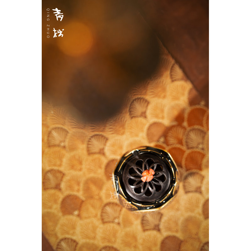 Swirling flowers on black Incense Burner