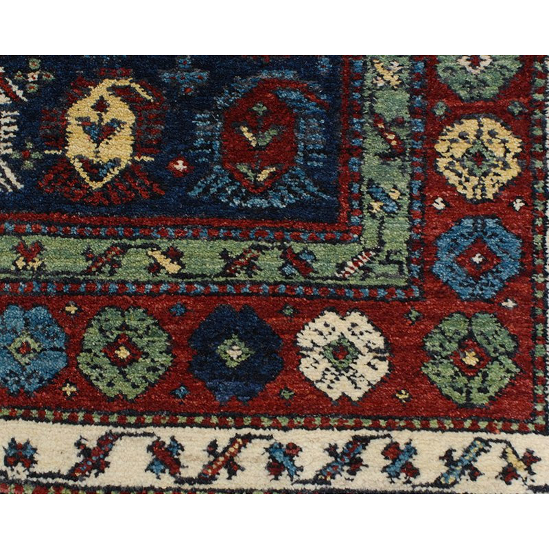 Seychour Wool Oriental Area Rug in Green/Red